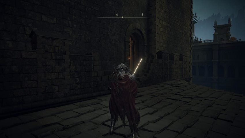 Screenshot of Elden Ring showing a doorway leading into a building