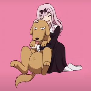 Chika holding a dog that doesn't look impressed